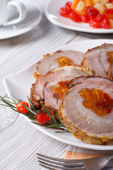 Christmas meal: pork roll with apricot and cherry