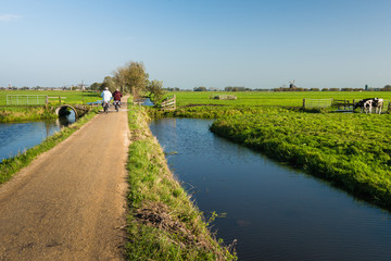 Two cyclists on a narrow road