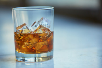 whiskey with ice on a table