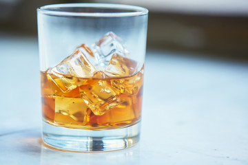 whiskey with ice on a table