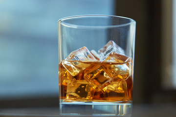 whiskey with ice on a table