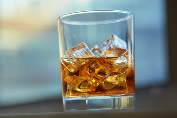 whiskey with ice on a table