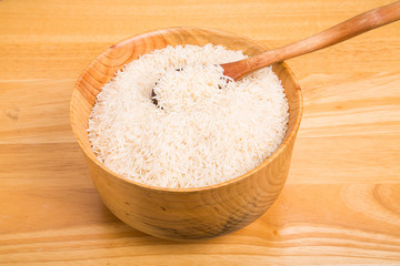 White Rice in Wood Bowl with Wood Spoon