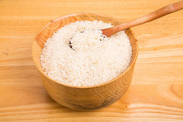 Fototapeta na wymiar White Rice in Wood Bowl with Wood Spoon