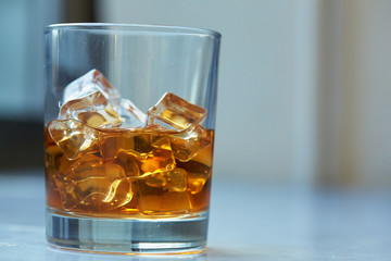 whiskey with ice on a table