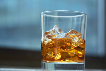 whiskey with ice on a table