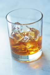 whiskey with ice on a table
