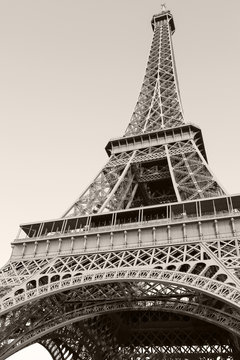 Fototapeta Looking up on Eiffel Tower, the most popular landmark of Paris
