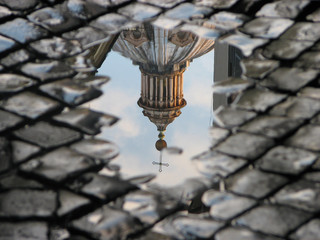 Rome Church dome in a puddle reflection