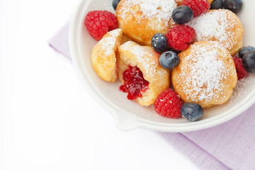 Traditional danish pancakes - ebelskivers with fresh berries