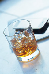 whiskey with ice on a table