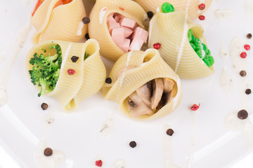 Fototapeta na wymiar Pasta shells stuffed with vegetables