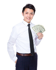 Businessman with spread of US dollar