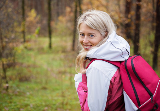 Young woman hiking in woods