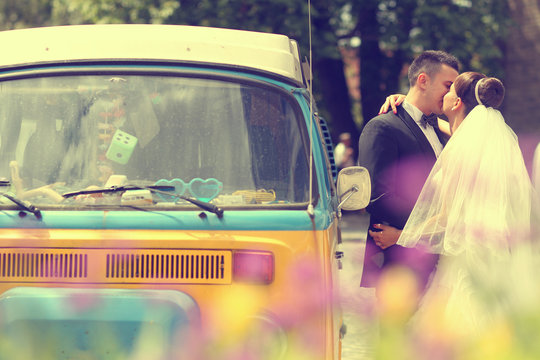 Bride And Groom Near A Van