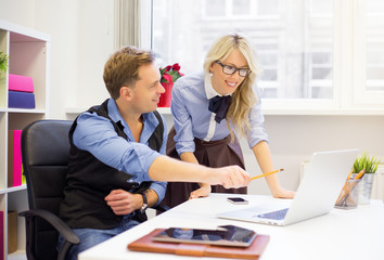 Man and female colleagues working together in the office
