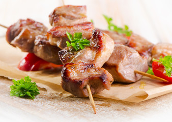 Pork kebabs served with vegetables