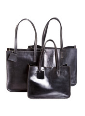Naklejka premium Three luxury carry bag black color isolated on white