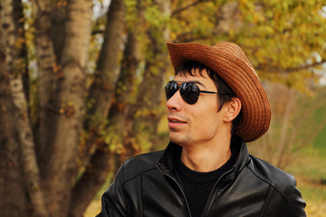Handsome young man in glasses and a hat.