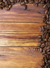 Coffee beans on wood background