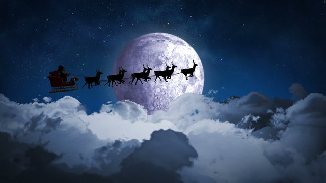 Santa flying over night sky