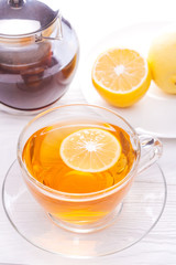 Cup of tea with lemon on table