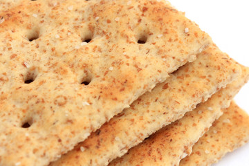 Extreme close-up of whole wheat saltine crackers