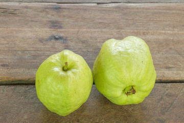 guava two balls on old wooden table.