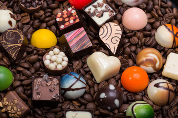 Set of a various chocolate pralines and coffee beans
