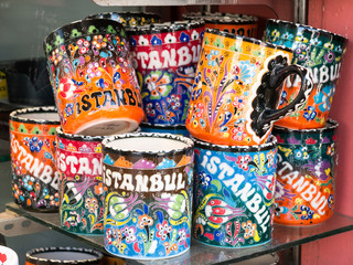 Collection of colourful handmade coffee mugs on a market stall
