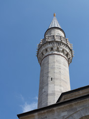 Fototapeta na wymiar Single minaret of an ottoman Mosque in Istanbul