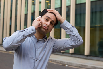 young business man looking fed up.