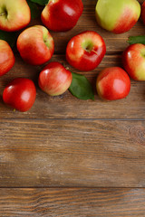 Sweet apples on wooden background