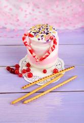 Cranberry milk dessert in glass jar,