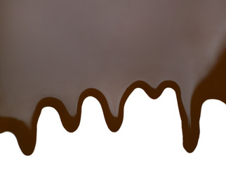 Melted chocolate dripping on white background