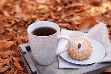 Cup of tasty hot drink and fresh cookies