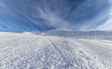 Skiing on groomed slope