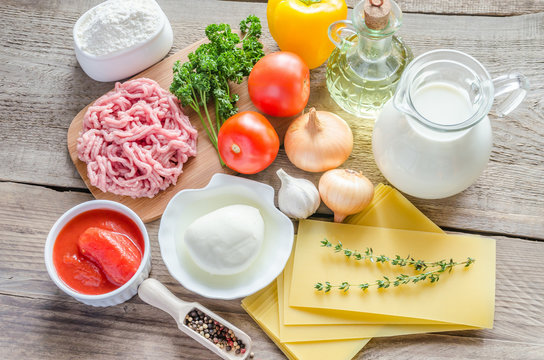 Ingredients for lasagne on the wooden background