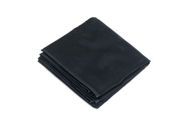 Pile of different fabrics isolated on white