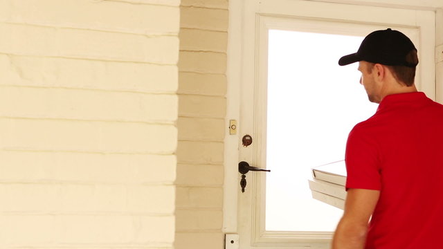 Pizza delivery man delivering pizzas