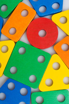 Colorful wooden baby blocks closeup