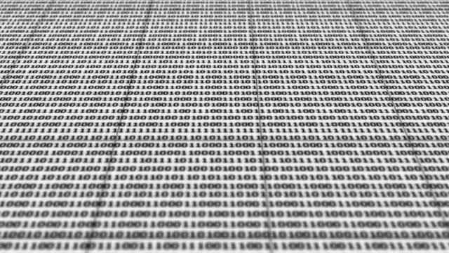 Scrolling black and white binary code