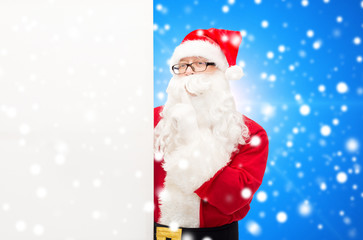 man in costume of santa claus with billboard