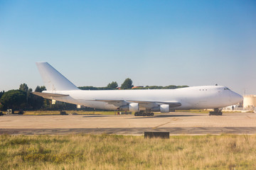 Fototapeta na wymiar Big Cargo Airplane at Airport Parking Area