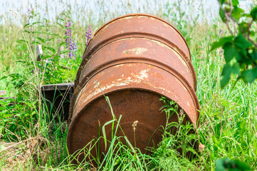 Old rusty barrel on gras