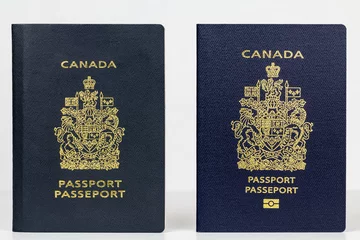 Wandaufkleber Old and new Canadian Passport © meisterphotos