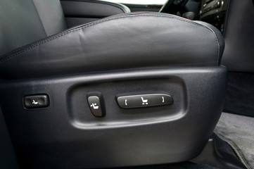 Buttons for adjusting seat position. Car interior.