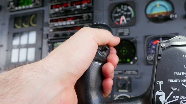 Pilot Resting Hand on Yoke During Flight POV