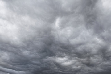 Dramatic grey storm clouds sky