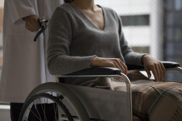 Doctors to push the wheelchair patient